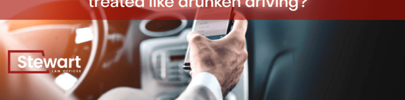 man texting while driving