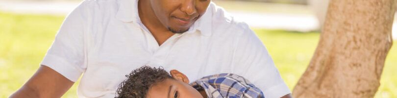 dad consoling son after losing a loved one