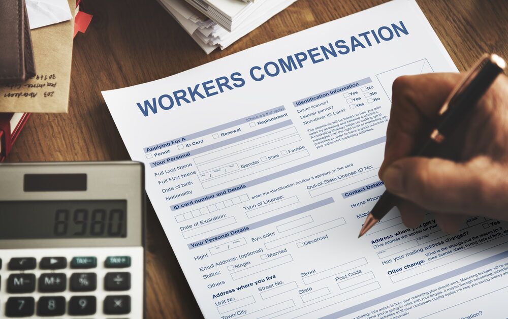 injured worked filing out workers compensation claim form