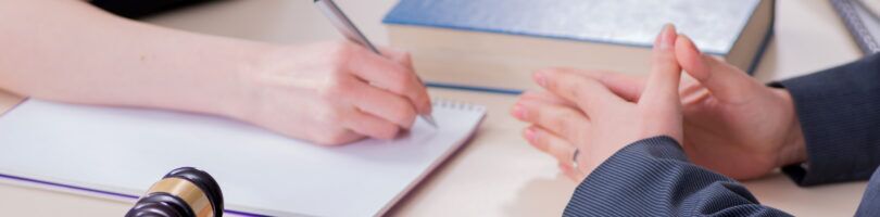 client working a workers comp lawyer to go over their claim