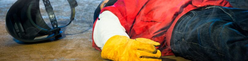 worker who has fallen on concrete floor