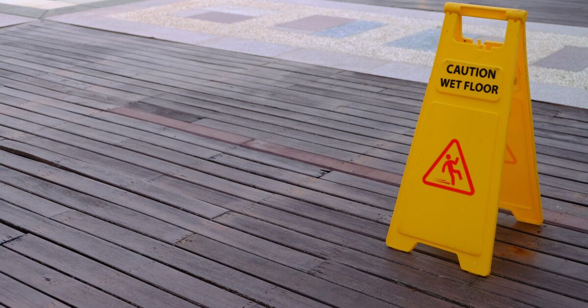 swimming pool with caution slippery sign