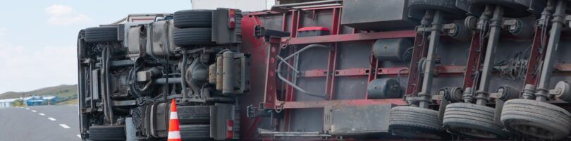 semi truck turned over on highway due to improperly loading