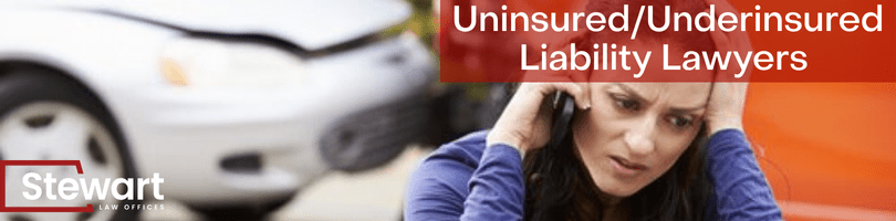 branded image with background image of women on phone in distress after being hit by an uninsured driver